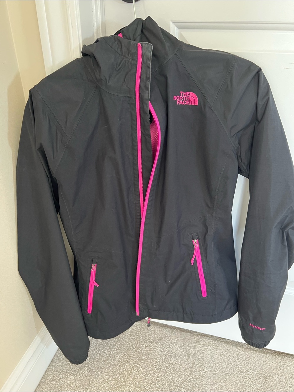 The North Face women’s Black Rain Jacket with Pink Trim